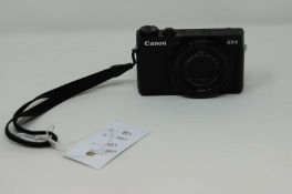 A pre-owned Canon PowerShot G9 X Mark II Compact Digital Camera in Black with battery pack (