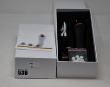 Two boxed as new handheld portable microdermabrasion tools.