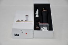 Two boxed as new handheld portable microdermabrasion tools.