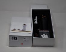 Two boxed as new handheld portable microdermabrasion tools.