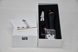 Two boxed as new handheld portable microdermabrasion tools (One box opened to photo content).