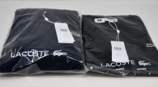 An as new Lacoste hoodie in blue marine (US XXL) and a Lacoste T-shirt (US L).