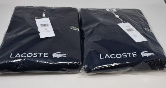 Two as new Lacoste hoodies in blue marine (US S).