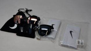 Two pairs of as new Nike sunglasses; Revere and Myriad.