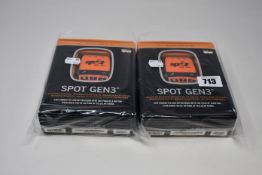 Two boxed as new Spot Gen3 Satellite GPS trackers.
