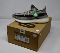 A pair of as new Adidas Yeezy Boost 350 V2 trainers (UK 7).