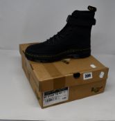 A pair of as new Dr Martens Combs Tech boots (UK 9).
