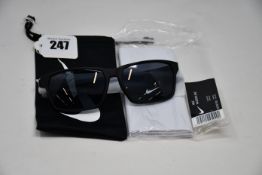 A pair of as new Nike Maverick RGE E sunglasses with protective pouch (RRP £137).