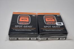 Two boxed as new Spot Gen3 Satellite GPS trackers.