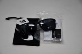 A pair of as new Nike Maverick RGE E sunglasses with protective pouch (RRP £137).