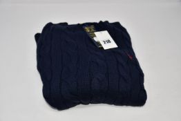 An as new Ralph Lauren cable knit jumper (M - RRP £135).