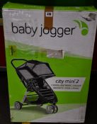 A boxed as new Baby Jogger City Mini 2 3-wheel light weight stroller (Box is unsealed with some
