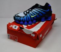 A pair of as new Nike Shox TL trainers (UK 7.5).