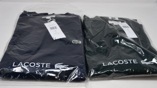 An as new Lacoste long sleeve polo in green (US XL) and a Lacoste sweater in blue marine (US M).