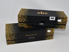 Two boxed as new She Gold Original Hair Styling Irons (IP40M).