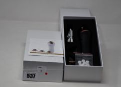 Two boxed as new handheld portable microdermabrasion tools.