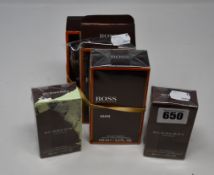 Three boxed as new Hugo Boss Man eau de toilette (100ml) and two boxed as new Burberry London Men