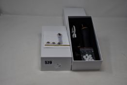 Two boxed as new handheld portable microdermabrasion tools.