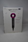 One boxed as new Dyson Supersonic hairdryer in Iron/Fuchsia.