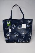 An as new Kate Spade Arch Place Mya reversible bag in navy (RRP $299).