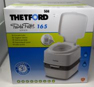 One boxed as new Thetford Porta Potti 165 portable flushing toilet.