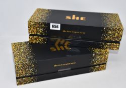 Two boxed as new She Gold Original Hair Styling Irons (IP40M).