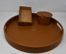 One three piece set of Lucrin Geneva home décor to include one Lucrin Amo set of twelve coasters,