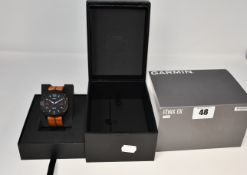 An as new Garmin Fenix X6 Sapphire watch black DLC/brown leather band.