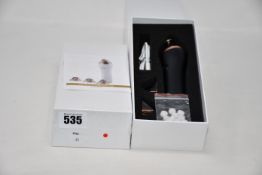 Two boxed as new handheld portable microdermabrasion tools.