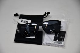 A pair of as new Nike Maverick RGE E sunglasses with protective pouch (RRP £137).