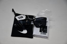 A pair of as new Nike Maverick RGE E sunglasses with protective pouch (RRP £137).