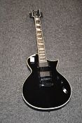 One boxed as new ESP Deluxe EC1000 electric guitar in vintage black.