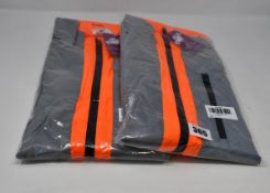 Two as new BTR high visibility reflective cycling/running jacket in orange (Both XL - RRP £40