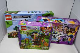 A Lego Minecraft The Crafting Box 3.0 21161, a Lego Friends Mia's Tree House 41335 and a Lego