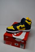 A pair of as new Nike Dunk Hi SP Retro Michigan 2020 (UK 7).