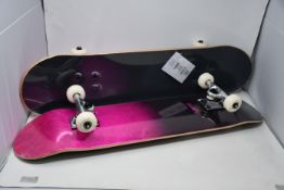 Four boxed as new Rocket 7.75 Double Dipped Complete Skateboards in purple.