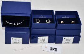 Three items of boxed as new Swarovski jewellery: Attract Bangle 5556912, Vittore Mini Hoop Pierced
