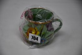 Six as new Mackenzie-Childs Flower Market enamel mugs green (RRP £50 per mug).