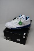 A pair of as new Nike Jordan V Low golf shoes (UK 9.5).