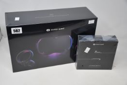 Two boxed as new Oculus Quest equipment and related items to include one Oculus Quest USB-C link