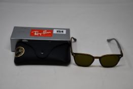 A pair of as new Ray Ban RB4258 sunglasses.