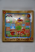 Twelve boxed as new Wood N Fun My First Wooden Activity calendar clocks.