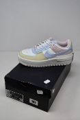 A pair of women's as new Nike Air Force 1 Shadow trainers (UK 4).