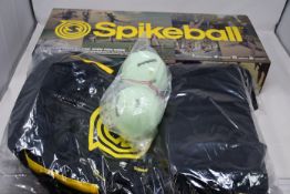 Two boxed Spikeball game sets with two Spikeball backpacks and four extra balls, all as new.