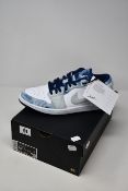 A pair of as new Nike Air Jordan 1 Low SE trainers (UK 9.5).