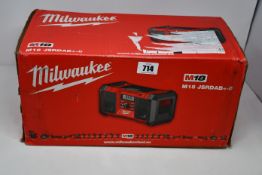 A boxed as new Milwaukee DAB site radio (M18 JSRDAB+-0).
