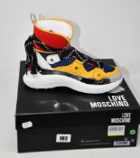 A pair of as new Love Moschino 2020 Ja15286g18iz175a Retemix trainers (EU 39).
