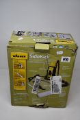A boxed Wagner Smart Sidekick multi-room powered roller for continuous painting.