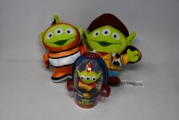 Two Disney Toy Story Alien Remix Plush Nemo, two Disney Toy Story Alien Remix Plush Woody and a