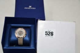 A ladies boxed as new Swarovski Crystaline Glam Watch with leather strap (Grey rose gold tone).